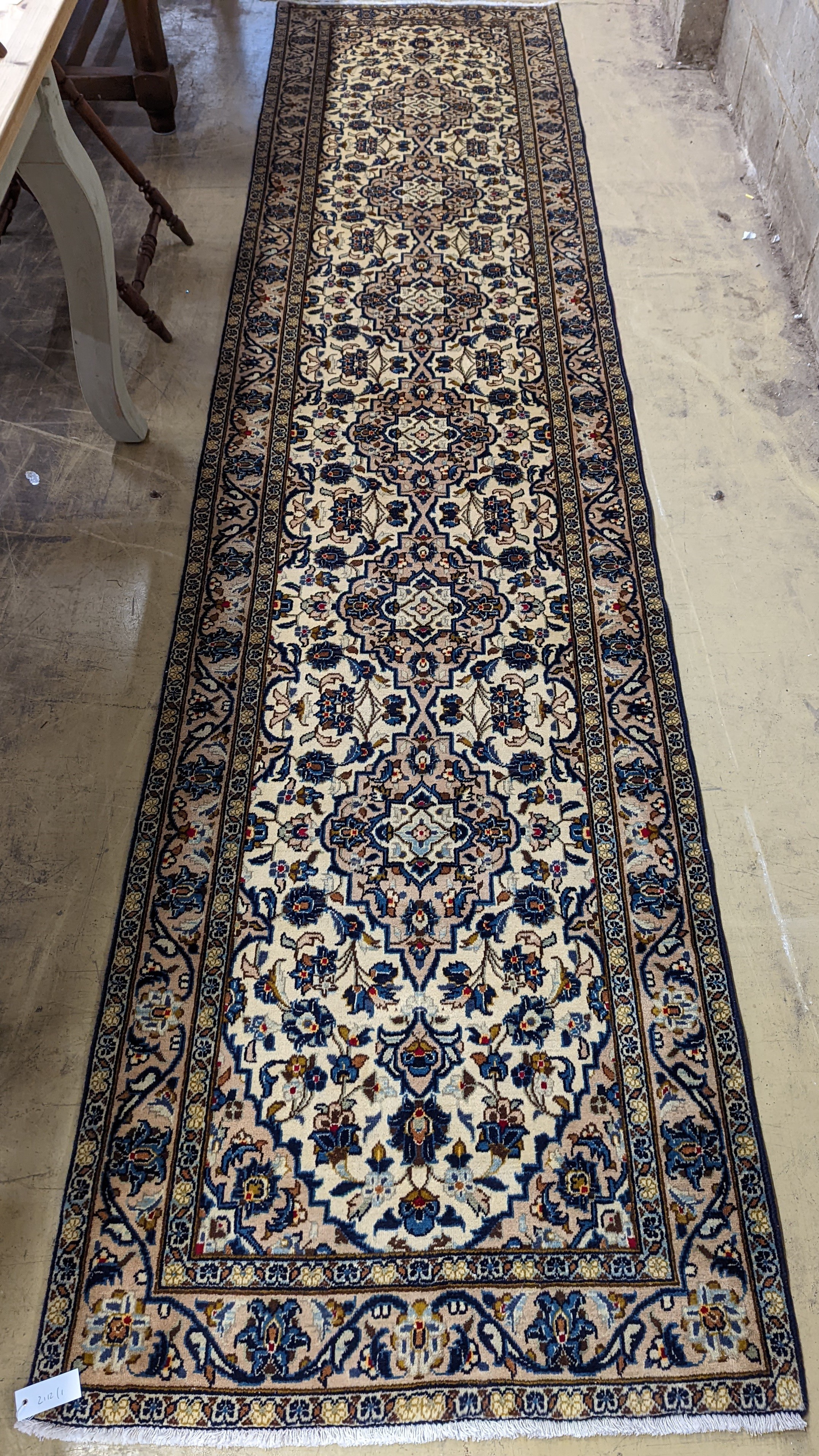 A Kashan ivory ground runner, 396 x 90cm